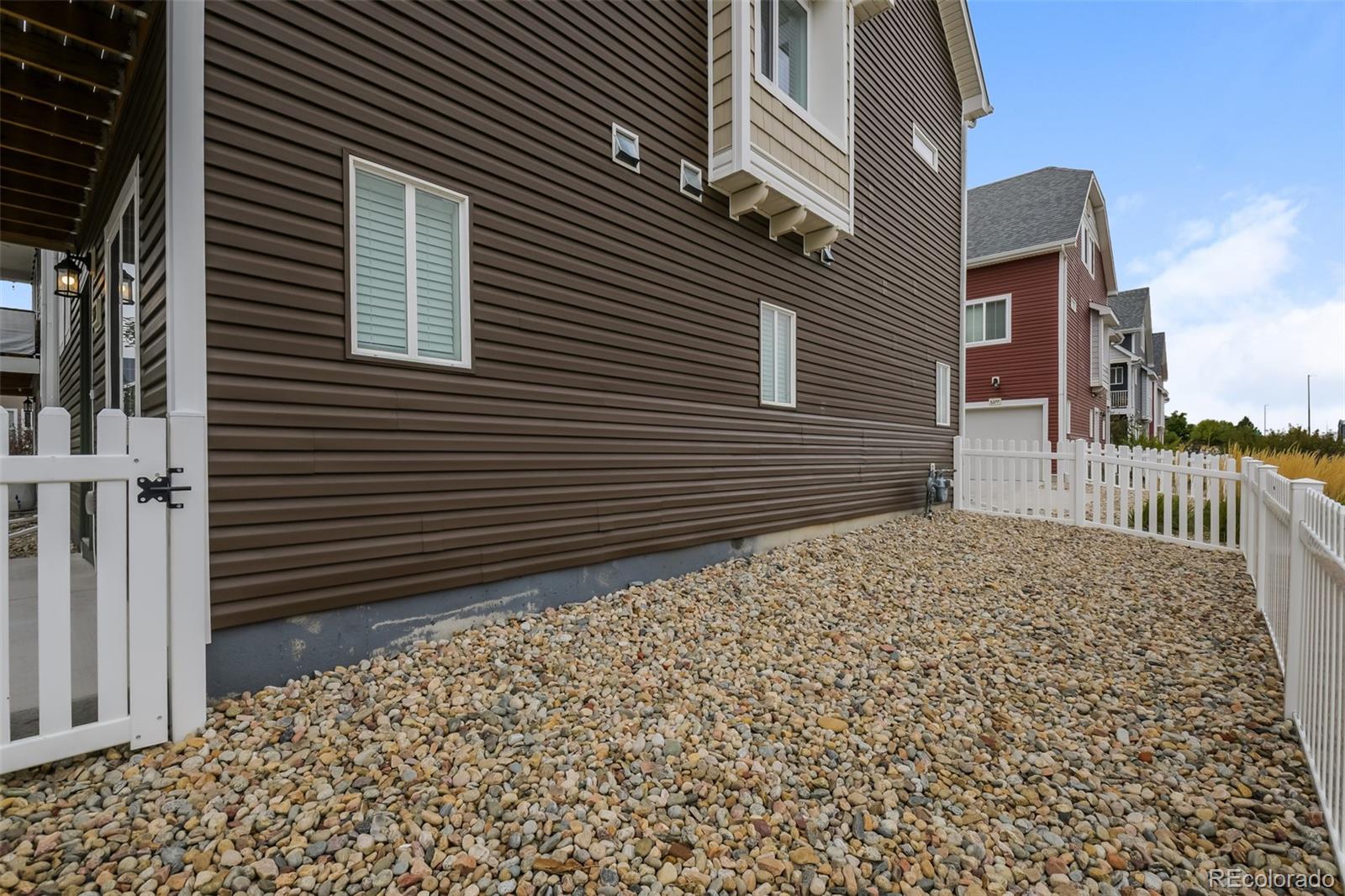 5383 Andes Street Denver, CO 80249 - Photo 14 of 18 a pathway of a house with a window