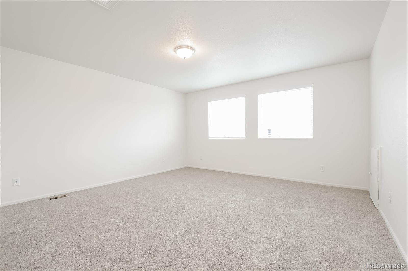 5383 Andes Street Denver, CO 80249 - Photo 7 of 18 an empty room with a window