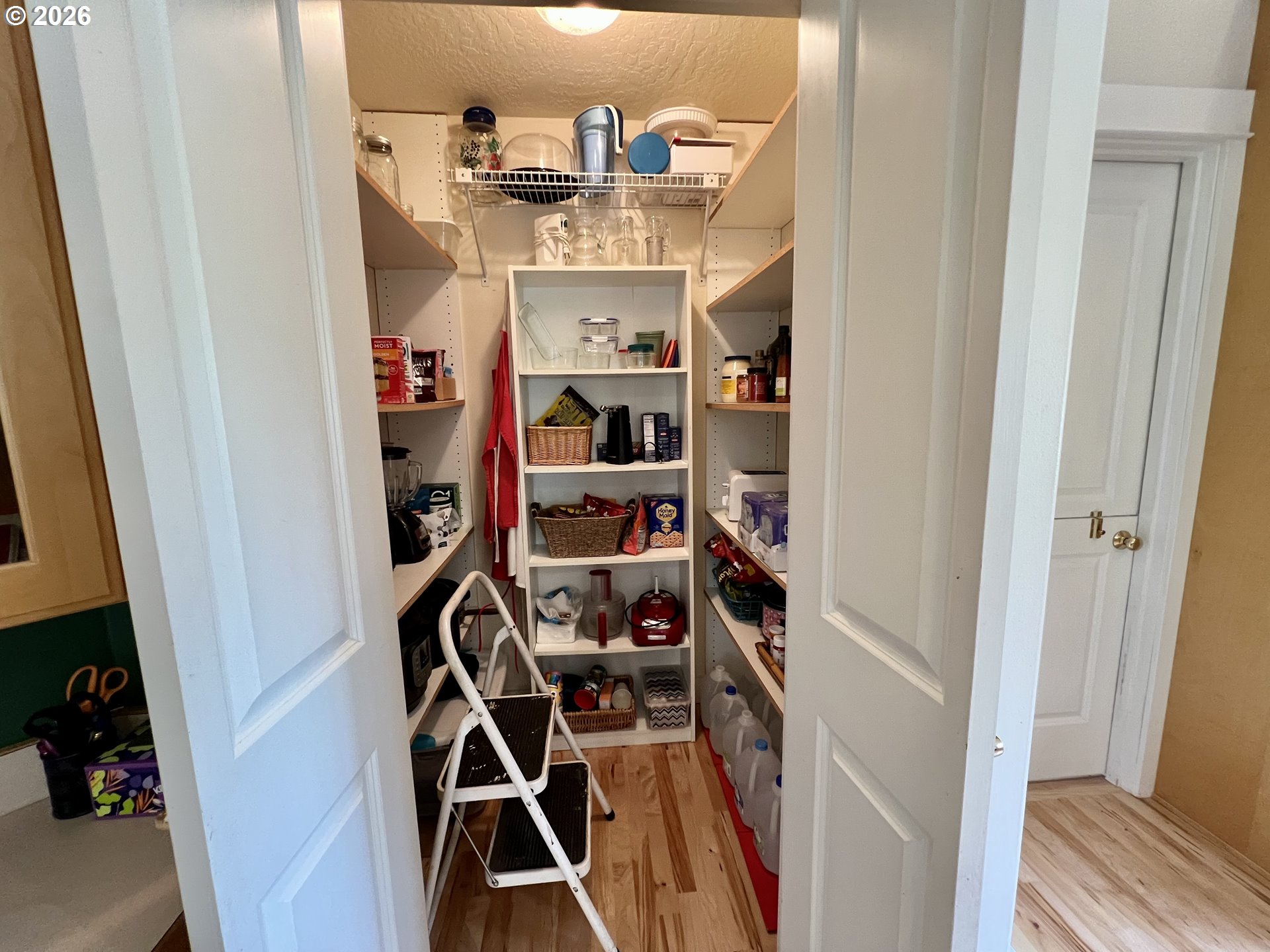 28544 Crow Road Eugene, OR 97402 - Photo 14 of 48 a view of walk in closet with clothes and shoes