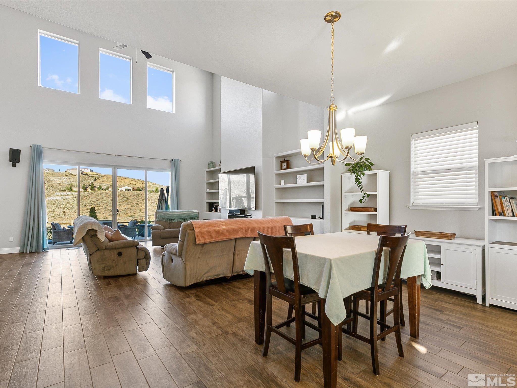 1564 Elk Run Trail Reno, NV 89523 - Photo 4 of 18 a view of a dining room with furniture window and wooden floor