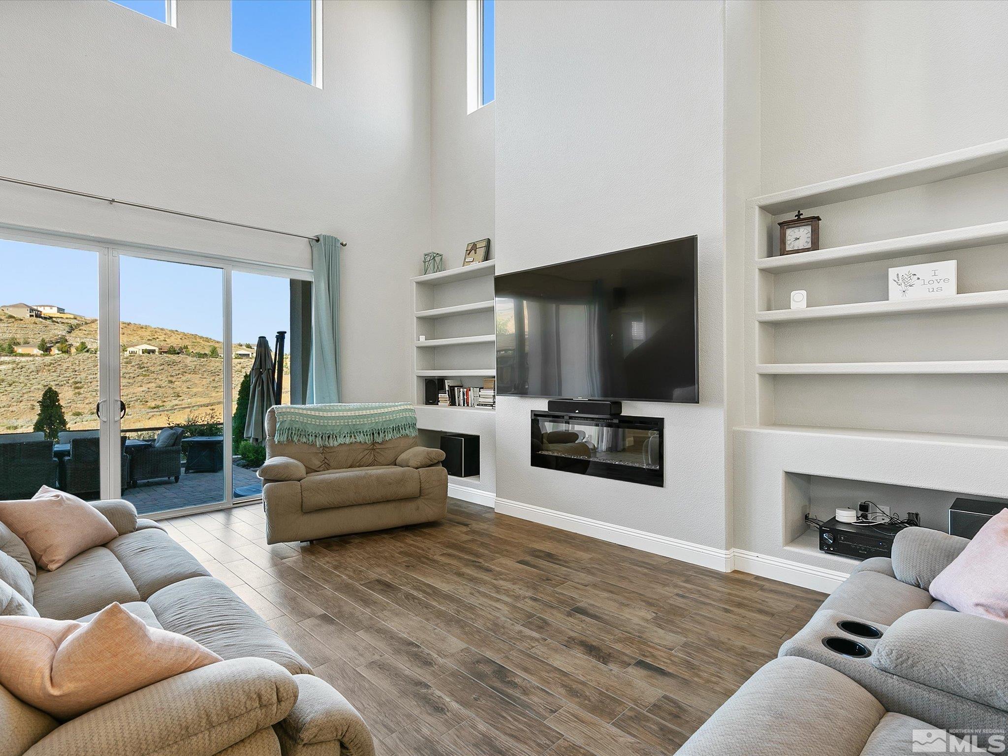 1564 Elk Run Trail Reno, NV 89523 - Photo 6 of 18 a living room with furniture and a flat screen tv