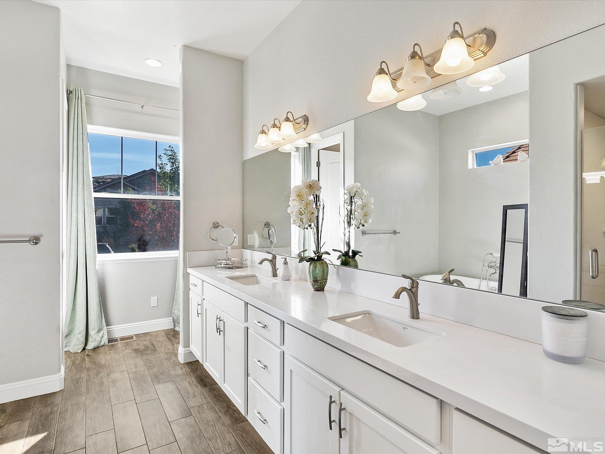 1564 Elk Run Trail Reno, NV 89523 - Photo 10 of 18 a bathroom with a sink double vanity granite and a mirror