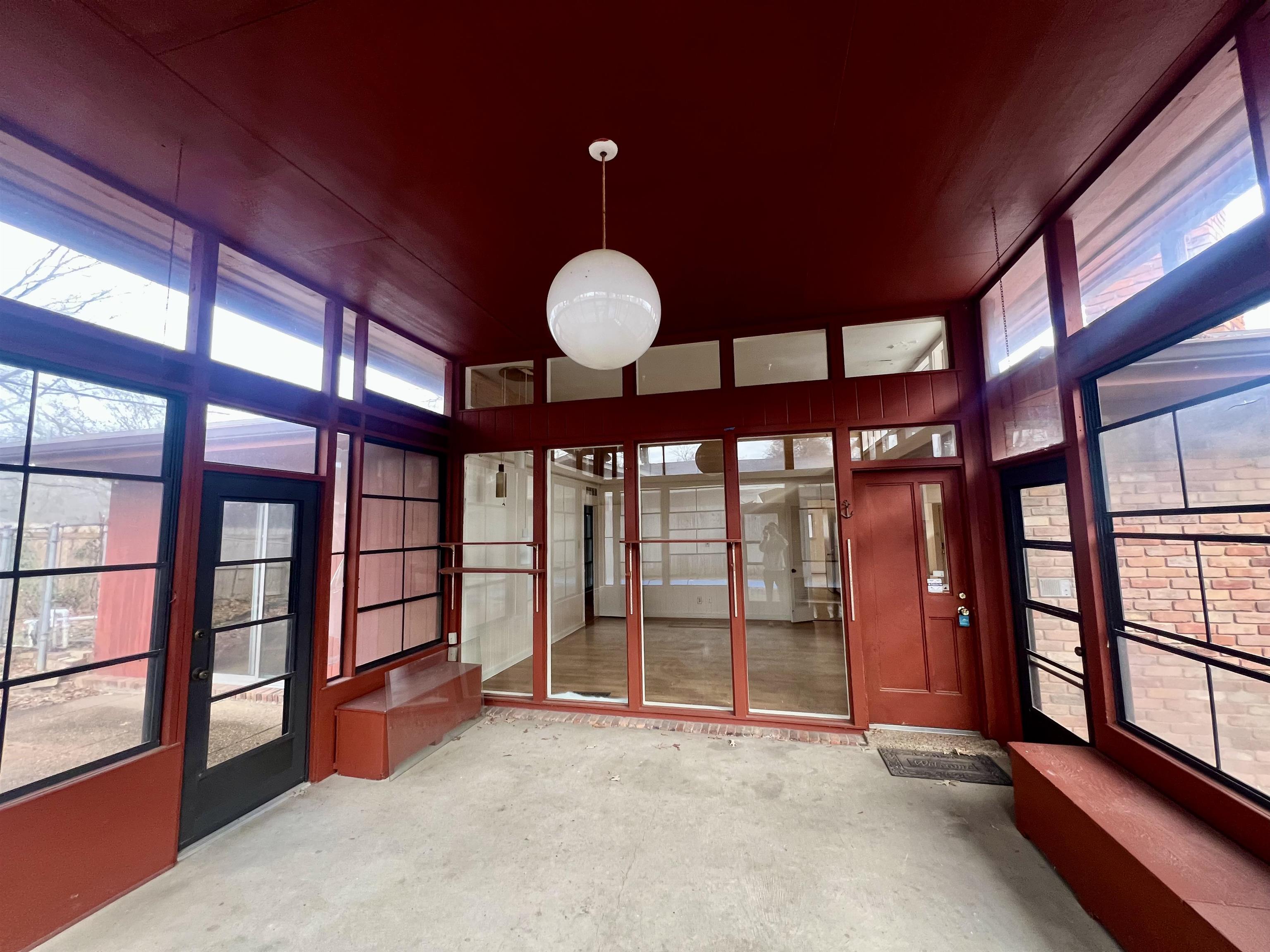 3153 Kirkcaldy Road Memphis, TN 38128 - Photo 21 of 28 Unfurnished sunroom featuring unfinished concrete floors