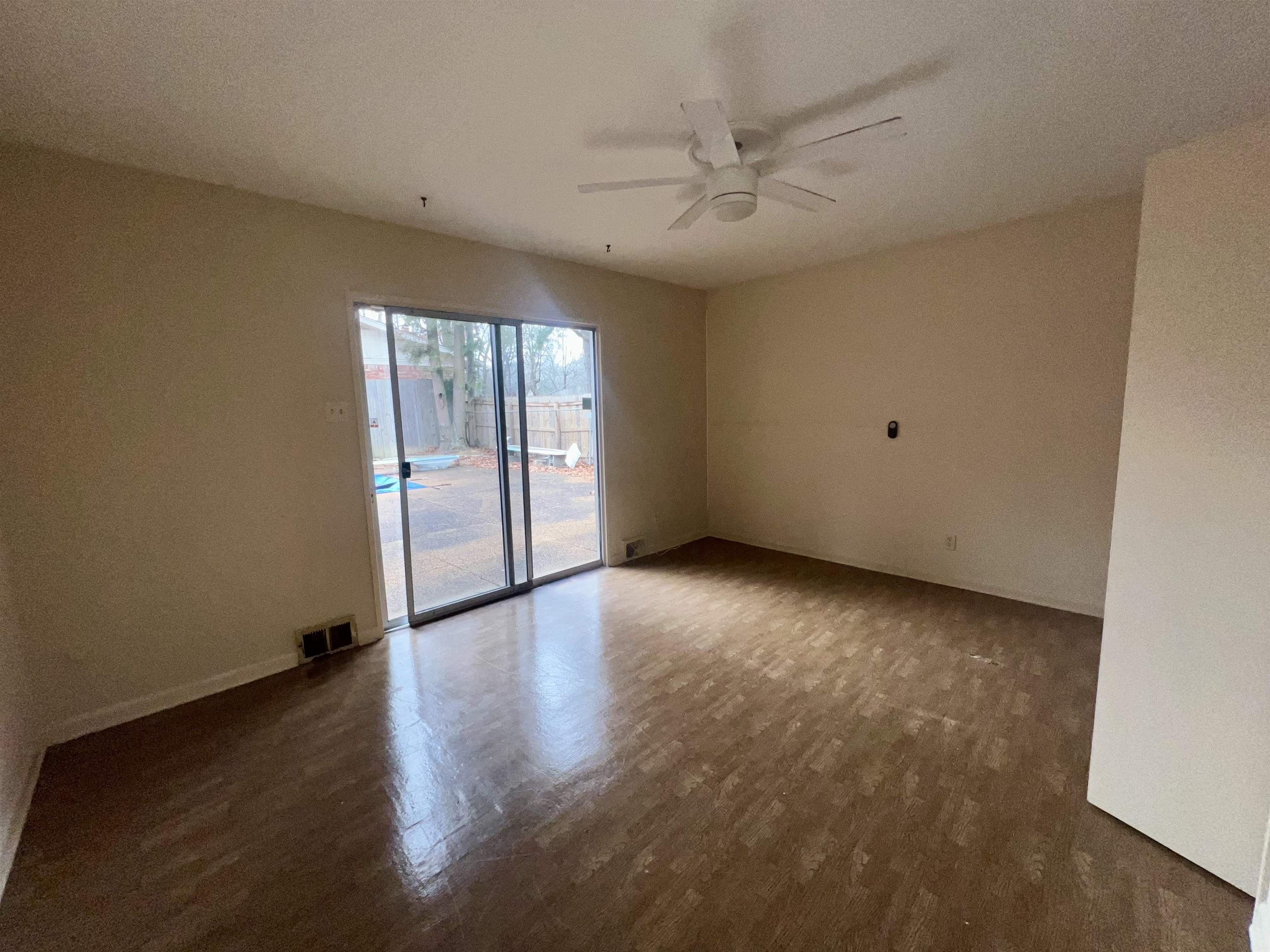 3153 Kirkcaldy Road Memphis, TN 38128 - Photo 28 of 28 Spare room featuring dark wood-type flooring, a ceiling fan, and a textured ceiling
