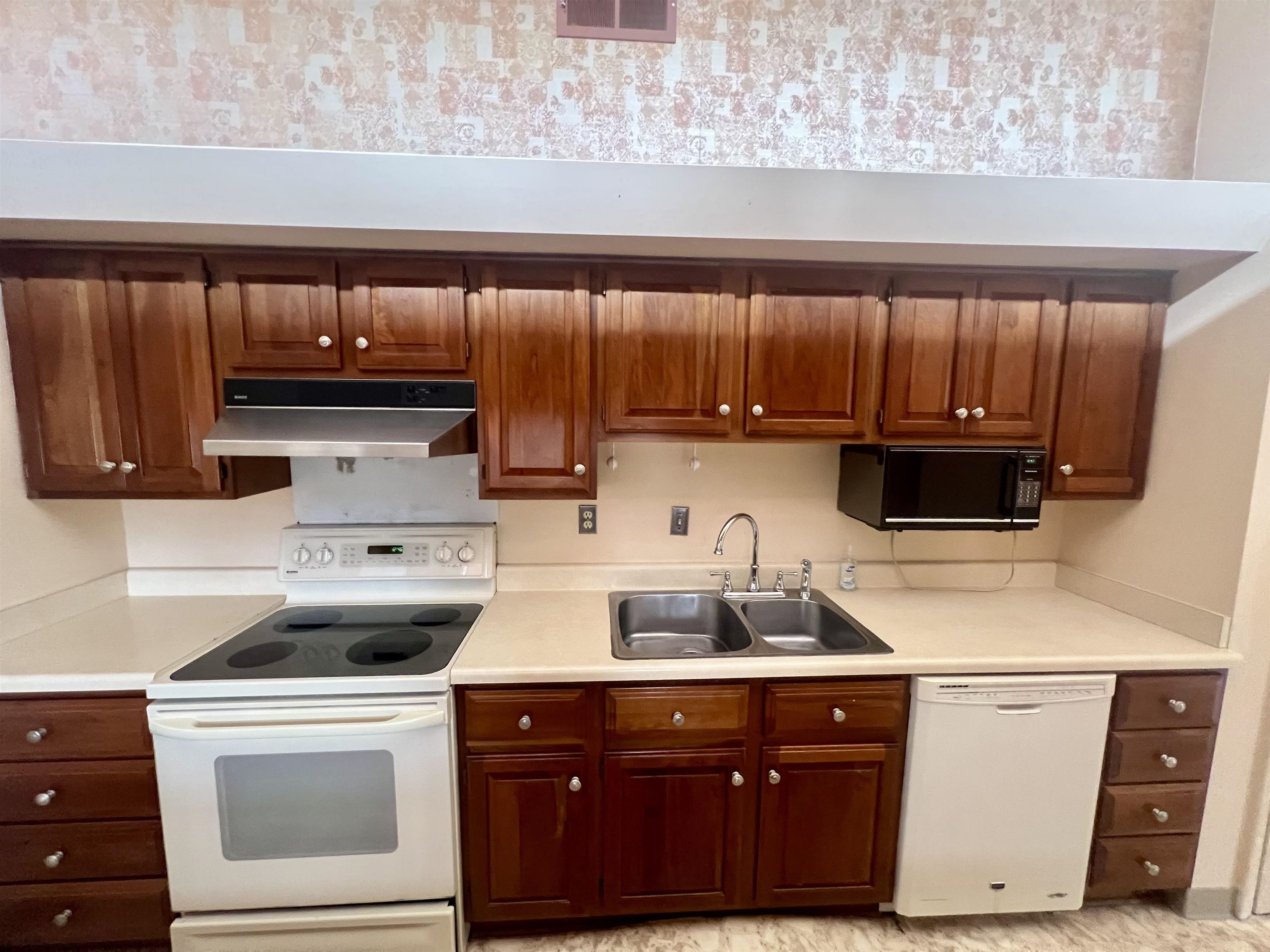 3153 Kirkcaldy Road Memphis, TN 38128 - Photo 6 of 28 Kitchen with white appliances, light countertops, and wood finish cabinets