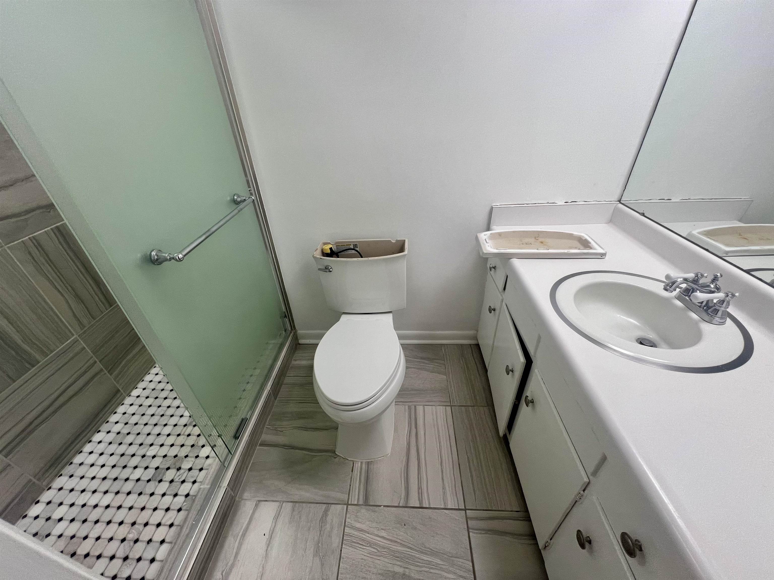 3153 Kirkcaldy Road Memphis, TN 38128 - Photo 10 of 28 Bathroom featuring vanity and a stall shower