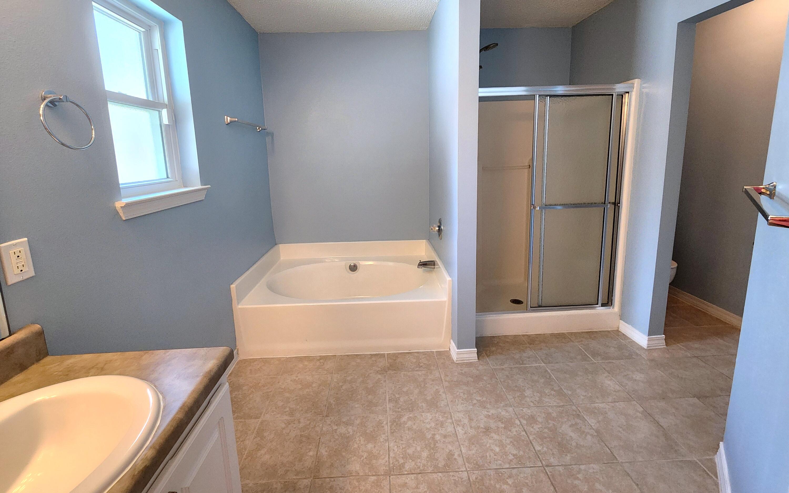 316 Egan Drive Crestview, FL 32536 - Photo 18 of 32 a bathroom with a tub toilet and sink