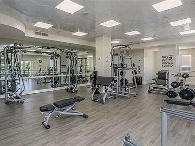4775 Collins Avenue, Unit 2105 Miami Beach, FL 33140 - Photo 14 of 21 a view of a room with gym equipment
