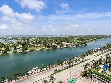 an aerial view of a city with ocean view