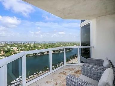 4775 Collins Avenue, Unit 2105 Miami Beach, FL 33140 - Photo 7 of 21 a terrace view with two chairs