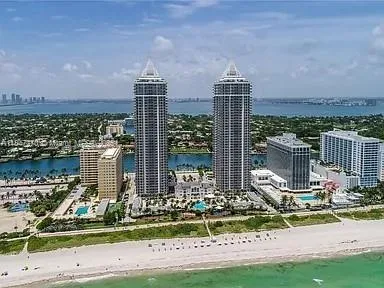 a front view of a building with a garden