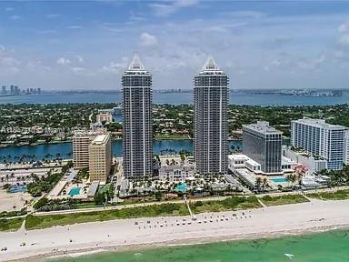 4775 Collins Avenue, Unit 2105 Miami Beach, FL 33140 - Photo 8 of 21 a front view of a building with a garden