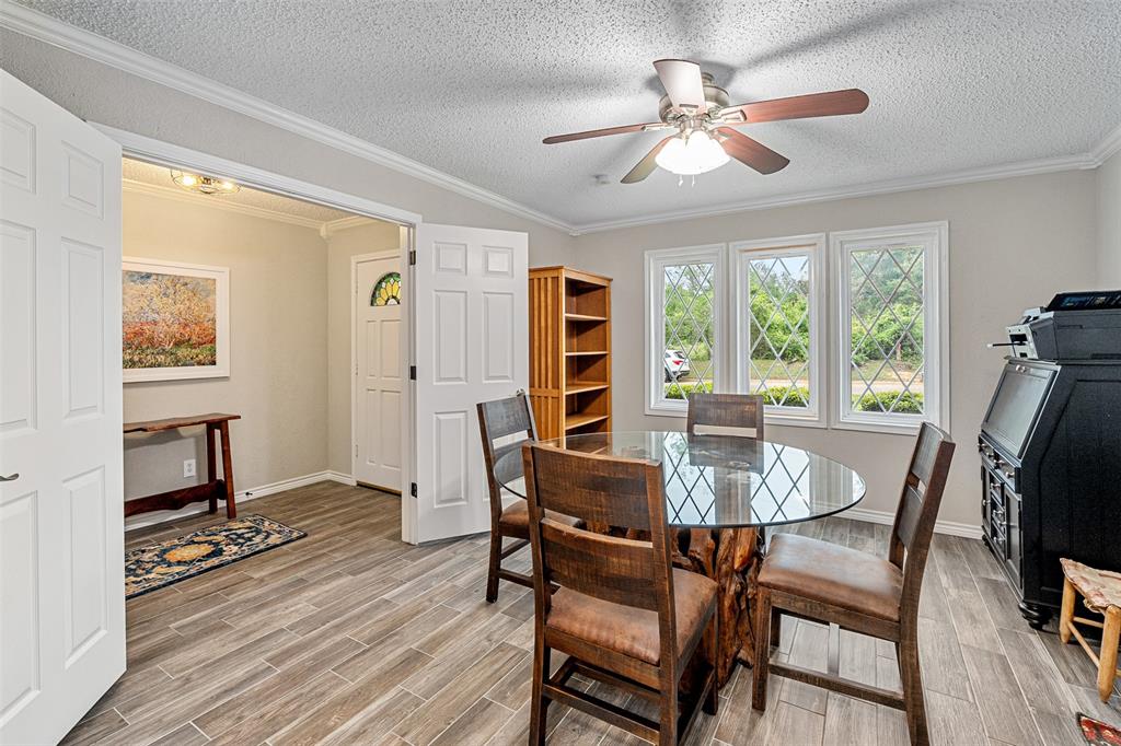 1102 Mill Run Road Athens, TX 75751 - Photo 4 of 35 a view of a dining room with furniture window and wooden floor