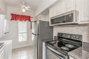 a kitchen with a stove and a microwave
