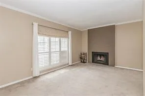 a view of an empty room with a fireplace