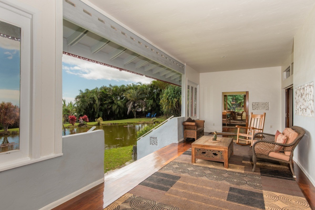 44-2325 Middle Road Honokaa, HI 96727 - Photo 13 of 28 a balcony with wooden floor and furniture