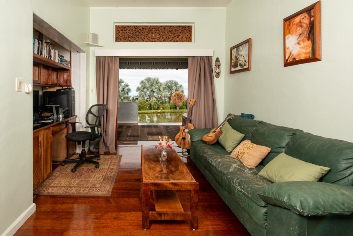 44-2325 Middle Road Honokaa, HI 96727 - Photo 16 of 28 a living room with furniture and a floor to ceiling window