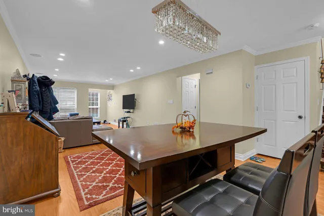a living room with furniture and stairs
