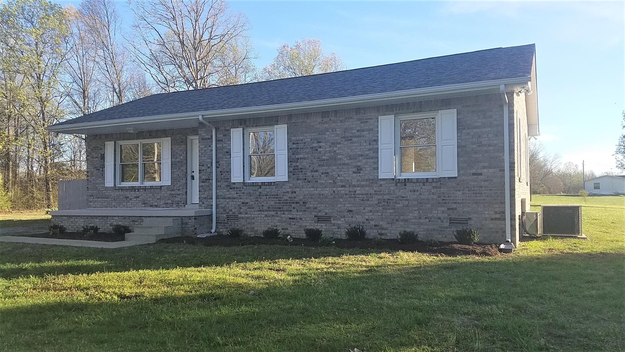 2666 She Boss Road Duck River, TN 38454 - Photo 3 of 22 Front of home with new landscaping!