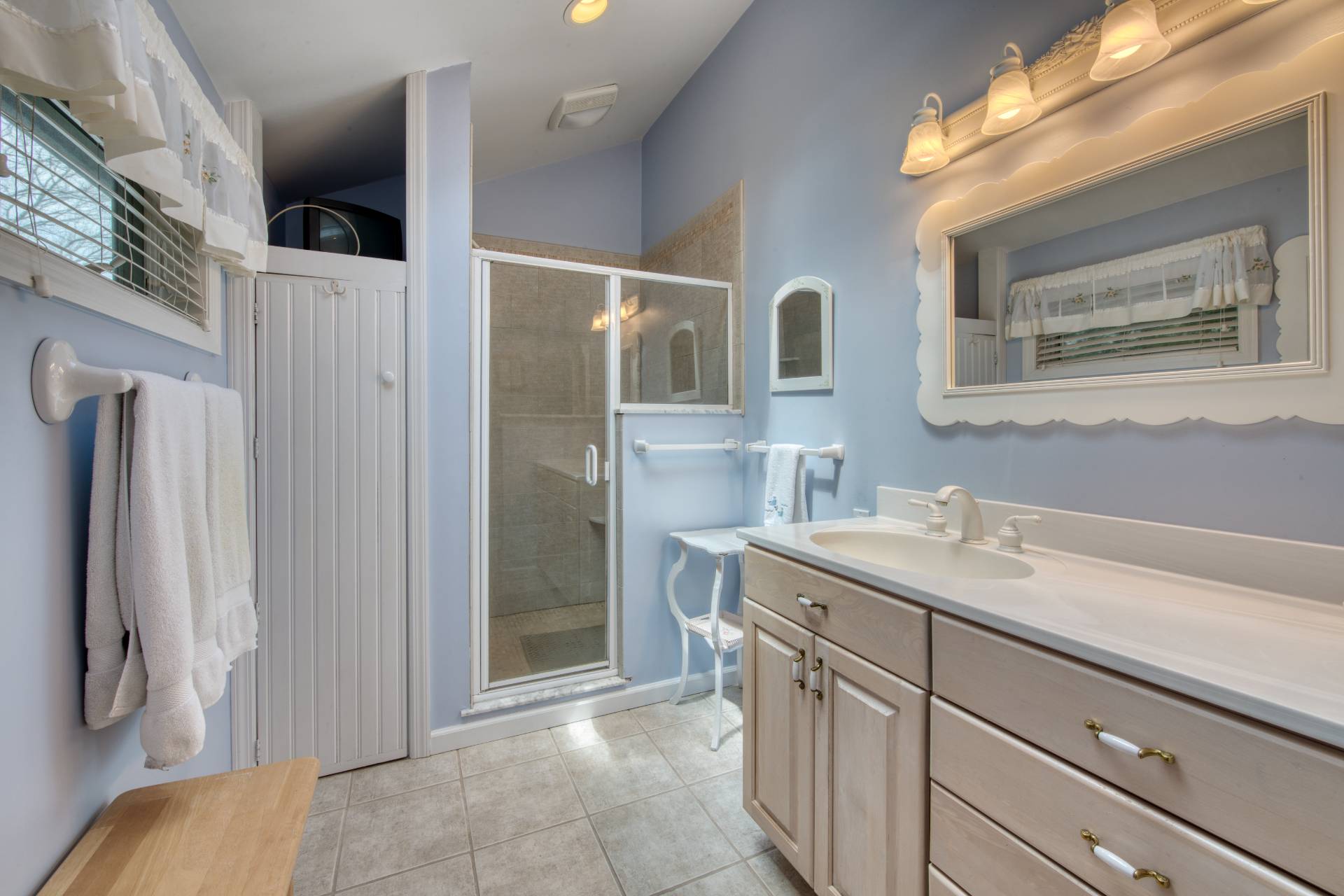 201 Three Mile Harbor Road East Hampton, NY 11937 - Photo 11 of 19 a bathroom with a sink and mirror
