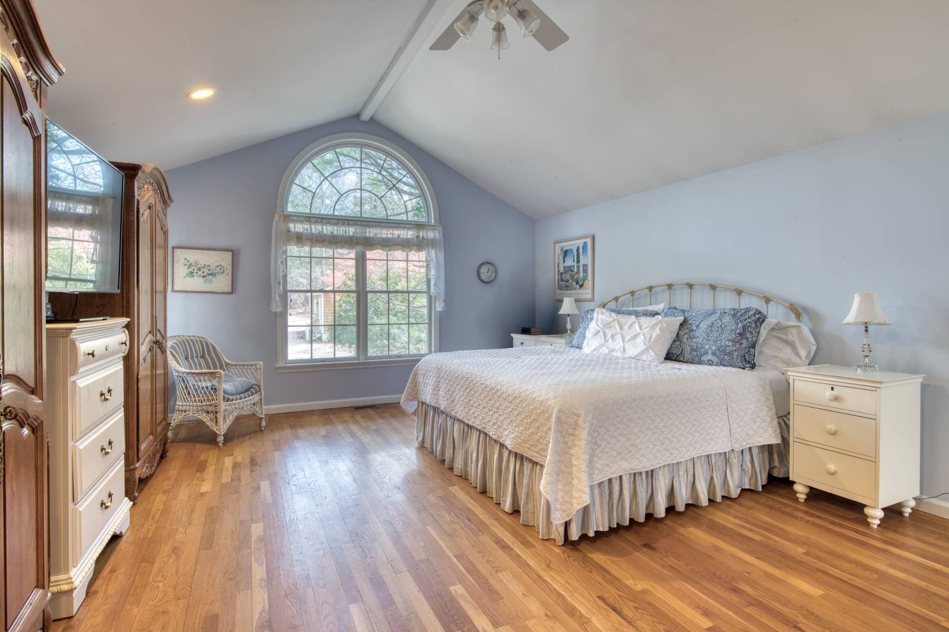 201 Three Mile Harbor Road East Hampton, NY 11937 - Photo 12 of 19 a bedroom with a bed and a large window
