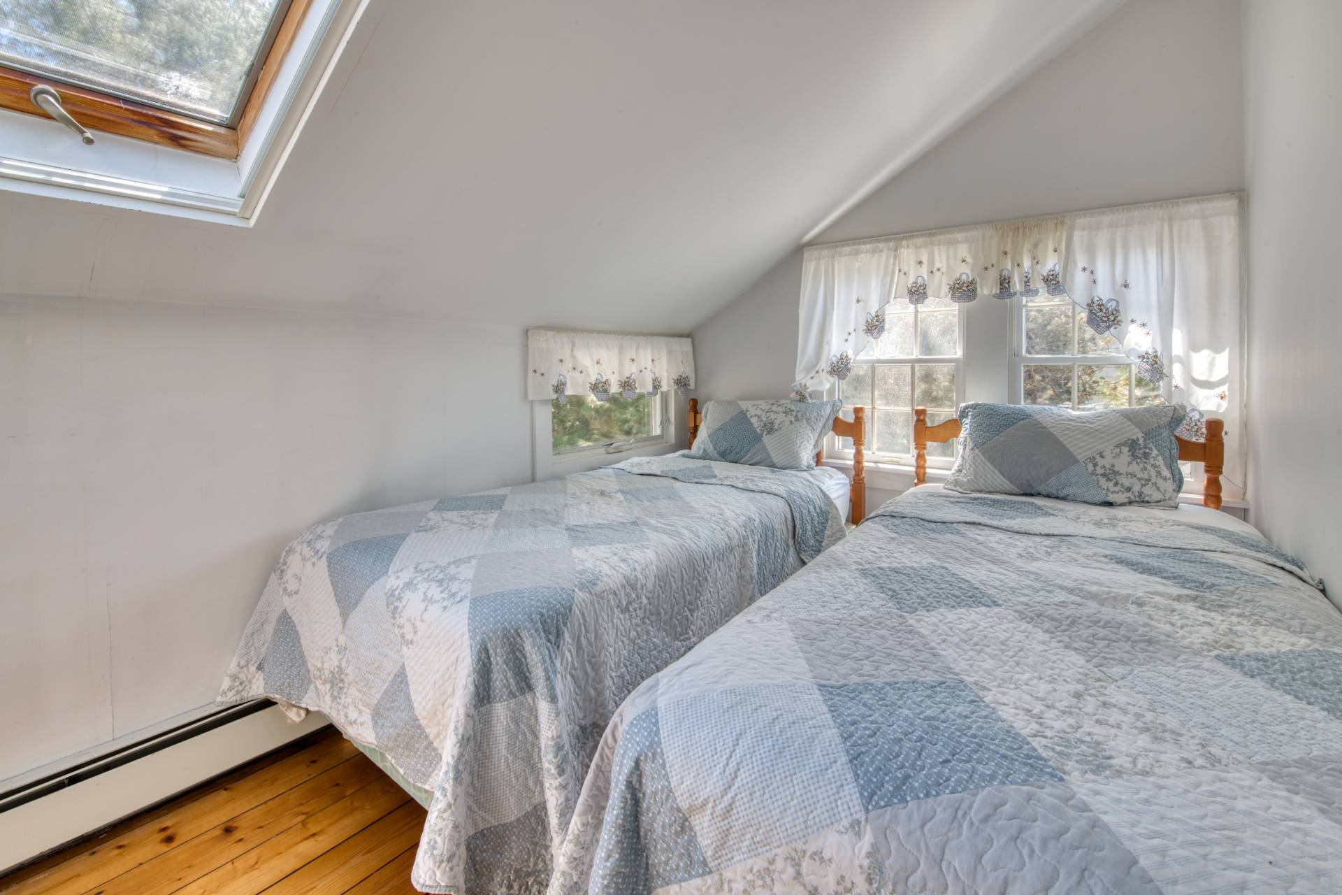201 Three Mile Harbor Road East Hampton, NY 11937 - Photo 16 of 19 a bedroom with two beds and a large window