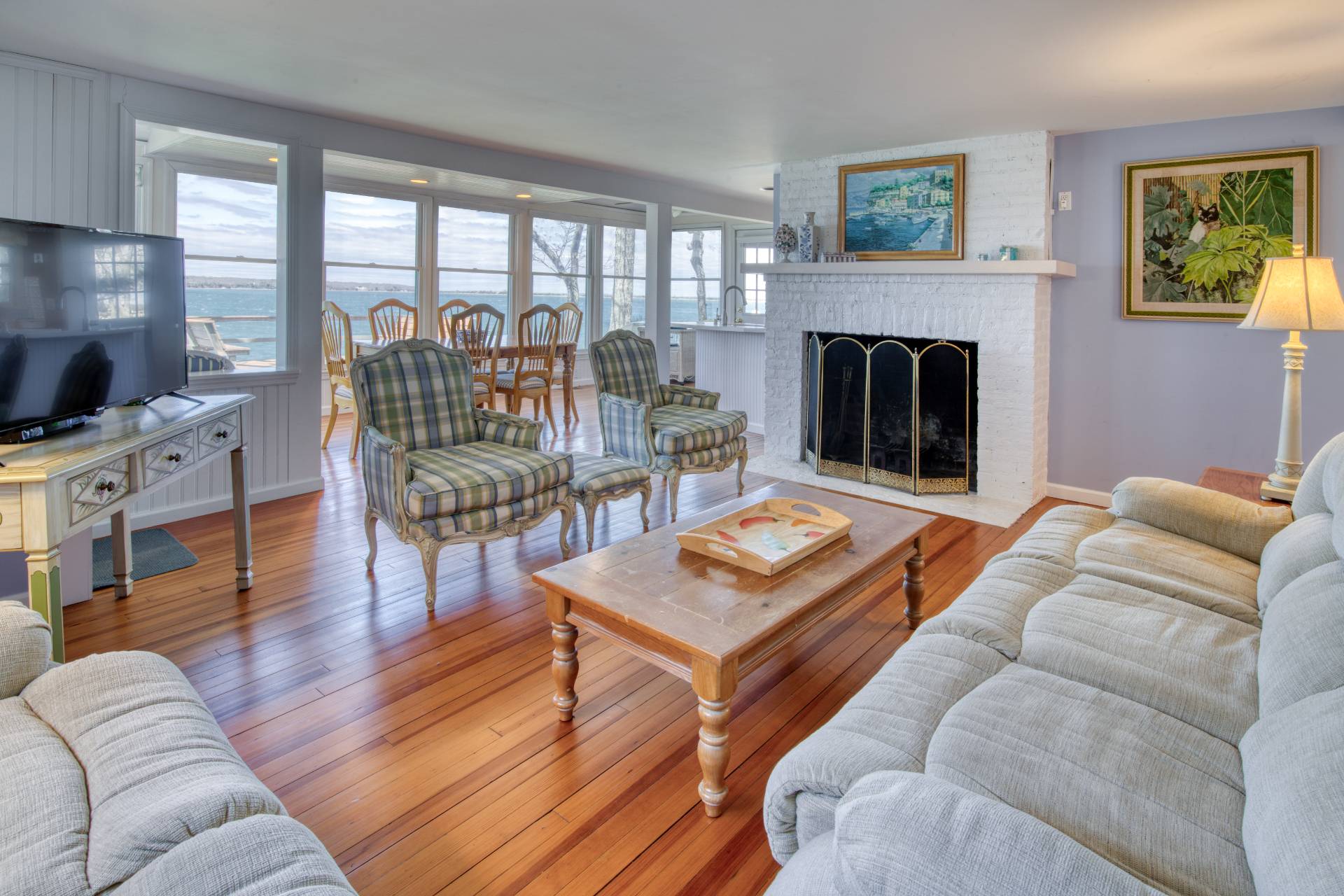 201 Three Mile Harbor Road East Hampton, NY 11937 - Photo 7 of 19 a living room with furniture and a fireplace