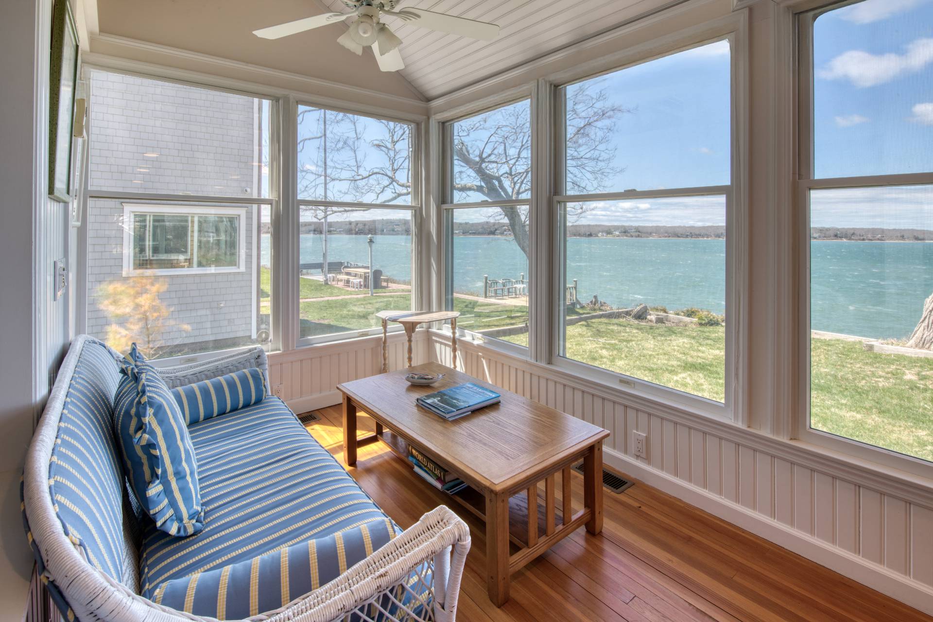 201 Three Mile Harbor Road East Hampton, NY 11937 - Photo 9 of 19 a view of a dining room with furniture large windows and wooden floor