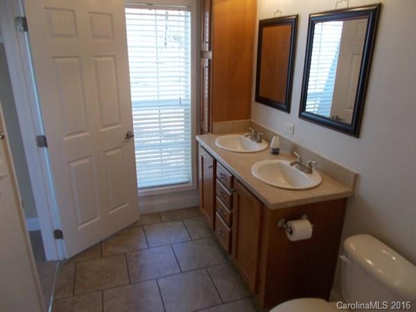 1604 Old Pardue Road Lancaster, SC 29720 - Photo 13 of 17 a bathroom with a sink a toilet and mirror
