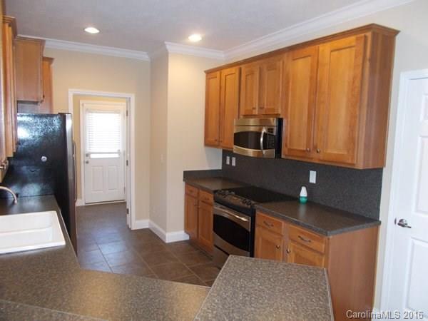 1604 Old Pardue Road Lancaster, SC 29720 - Photo 7 of 17 a kitchen with stainless steel appliances granite countertop a stove a sink and a refrigerator