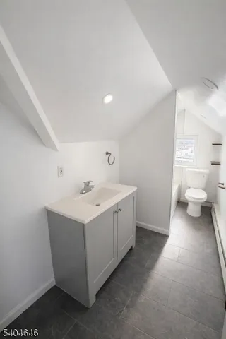 a view of a storage & utility room with a sink