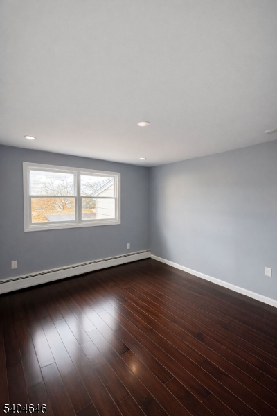 28 Treptow Street, Unit 2 Little Ferry, NJ 07643 - Photo 5 of 8 a view of an empty room with wooden floor and a window