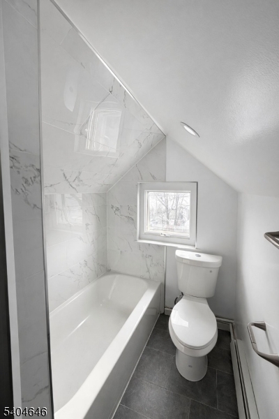 28 Treptow Street, Unit 2 Little Ferry, NJ 07643 - Photo 6 of 8 a bathroom with a toilet and a bathtub