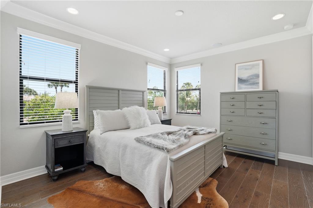 4220 Amelia Way Naples, FL 34119 - Photo 25 of 50 a bedroom with a bed and a window