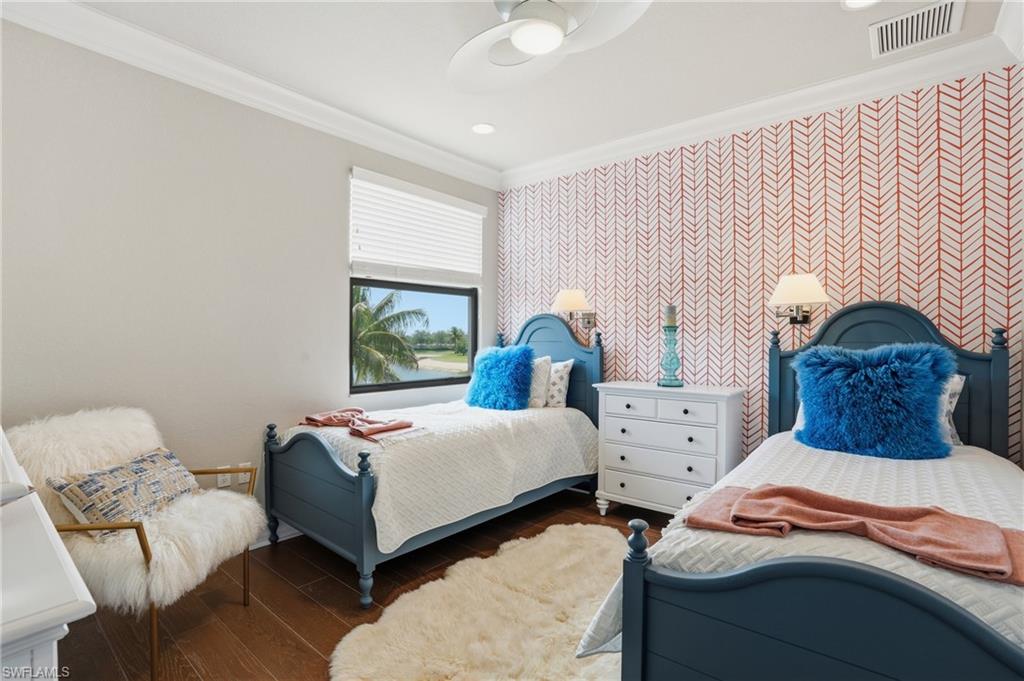 4220 Amelia Way Naples, FL 34119 - Photo 31 of 50 a bedroom with two beds and a large window