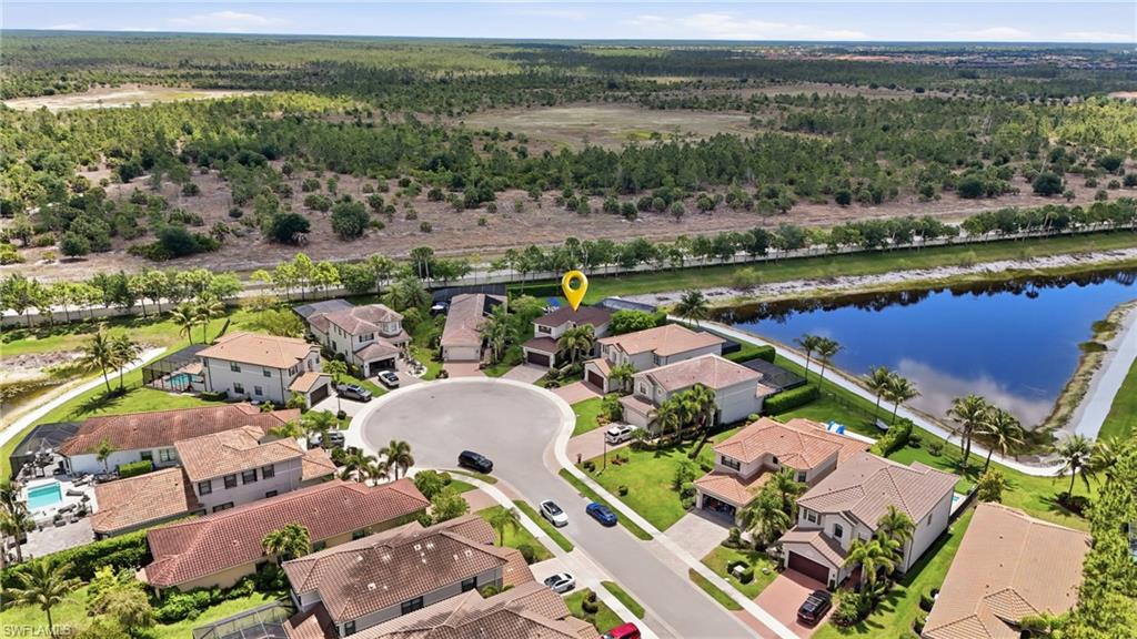 4220 Amelia Way Naples, FL 34119 - Photo 4 of 50 an aerial view of ocean and residential houses with outdoor space