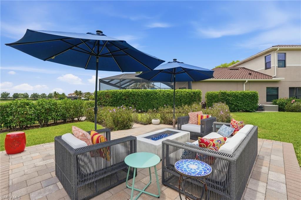 4220 Amelia Way Naples, FL 34119 - Photo 45 of 50 a outdoor living space with furniture and garden