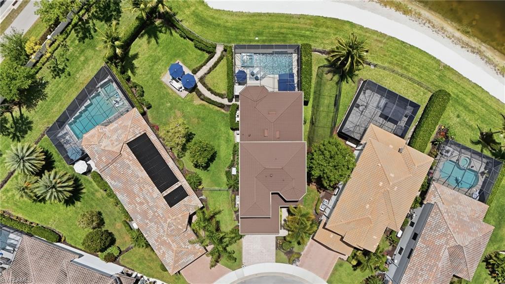 4220 Amelia Way Naples, FL 34119 - Photo 46 of 50 an aerial view of a house with garden space and street view