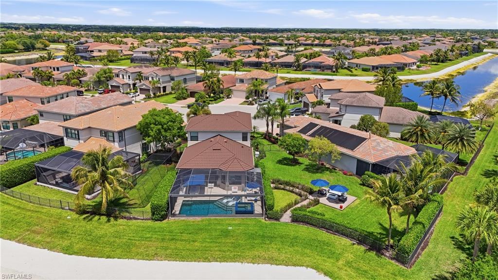 4220 Amelia Way Naples, FL 34119 - Photo 47 of 50 an aerial view of a house with a garden