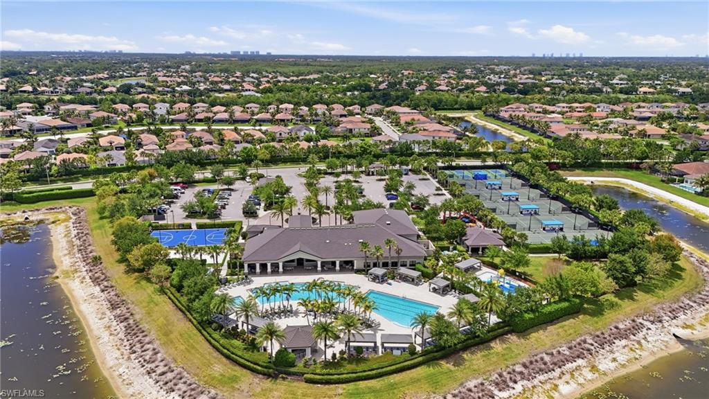 4220 Amelia Way Naples, FL 34119 - Photo 48 of 50 an aerial view of residential houses with outdoor space and lake view
