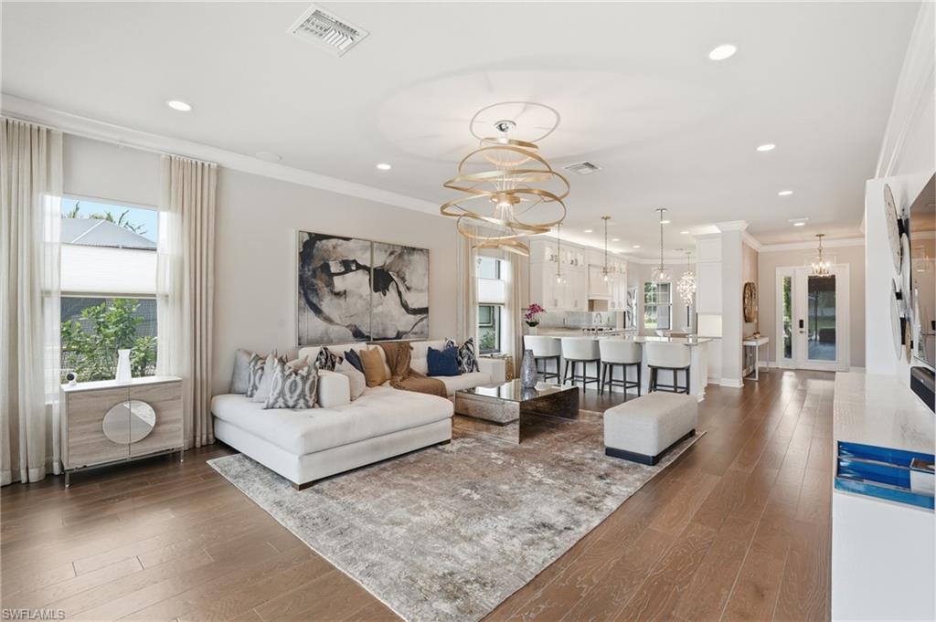 4220 Amelia Way Naples, FL 34119 - Photo 7 of 50 a living room with furniture and a large window