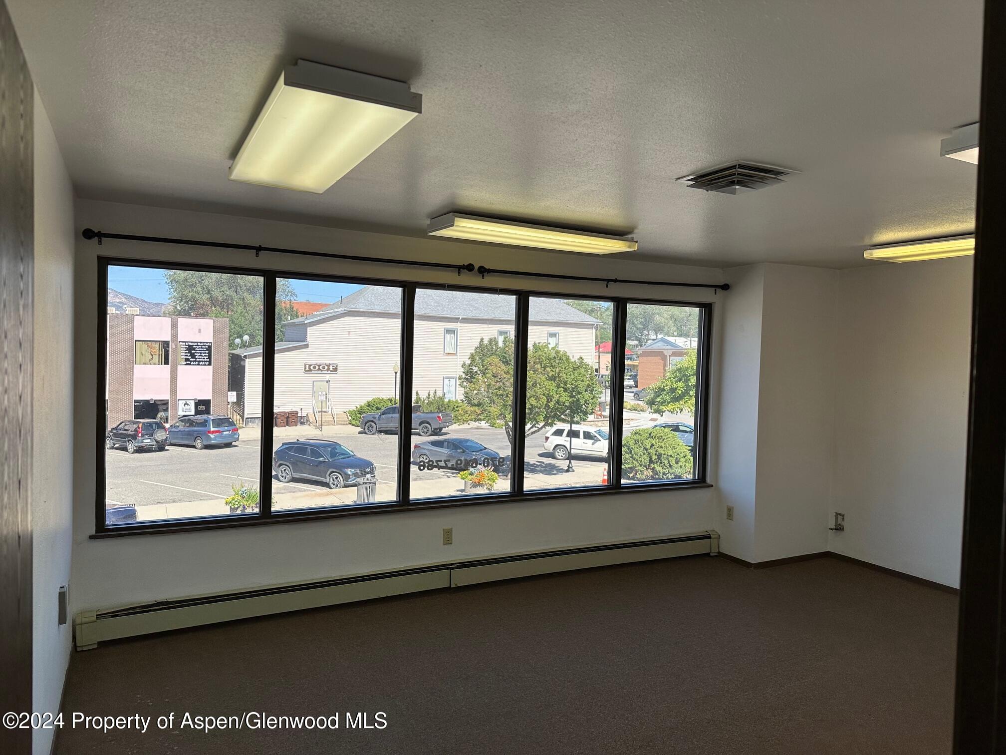 125 West 4th Street, Unit 210 Rifle, CO 81650 - Photo 3 of 8 a view of an empty room with a window