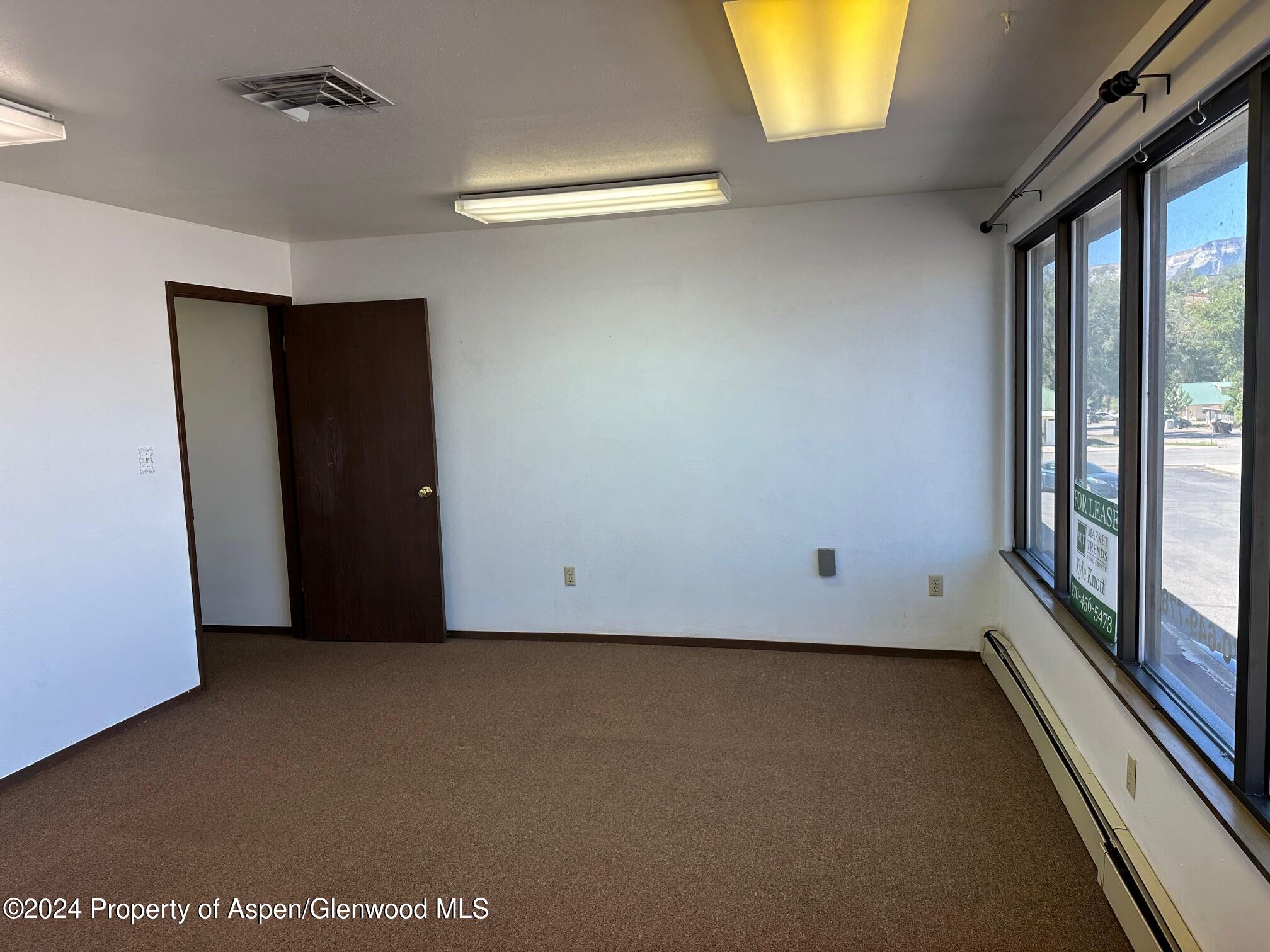 125 West 4th Street, Unit 210 Rifle, CO 81650 - Photo 5 of 8 an empty room with a window