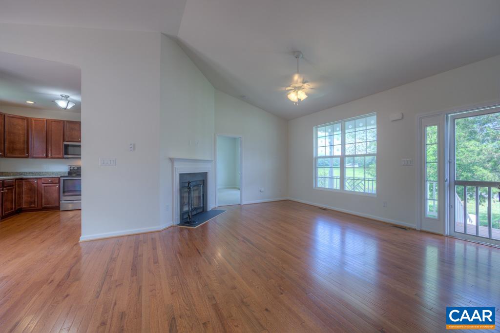 209 Cedar Run Road Ruckersville, VA 22968 - Photo 8 of 32 a view of an empty room with wooden floor and a window