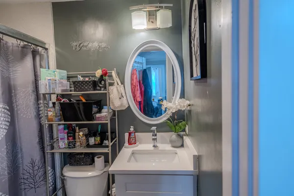 a bathroom with a sink and a mirror
