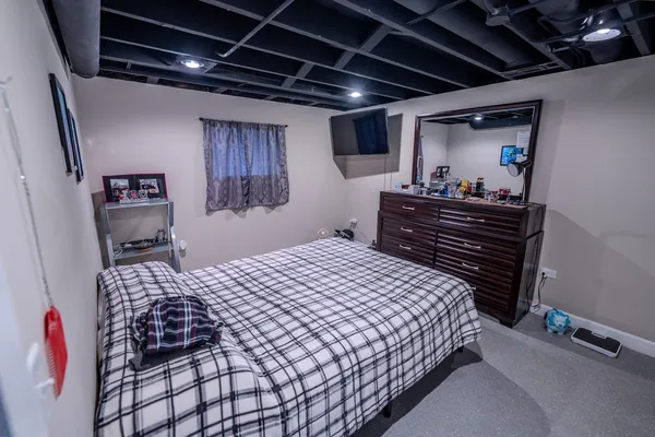 a bedroom with a bed and a walk in closet