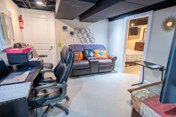 a bedroom with furniture and a window