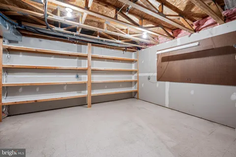 a view of an empty room with white walls
