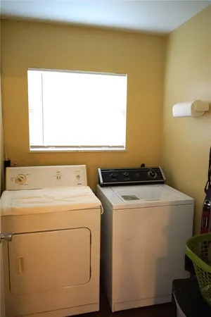 a utility room with dryer and washer