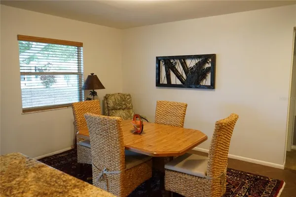 a blue and white sitting area with furniture